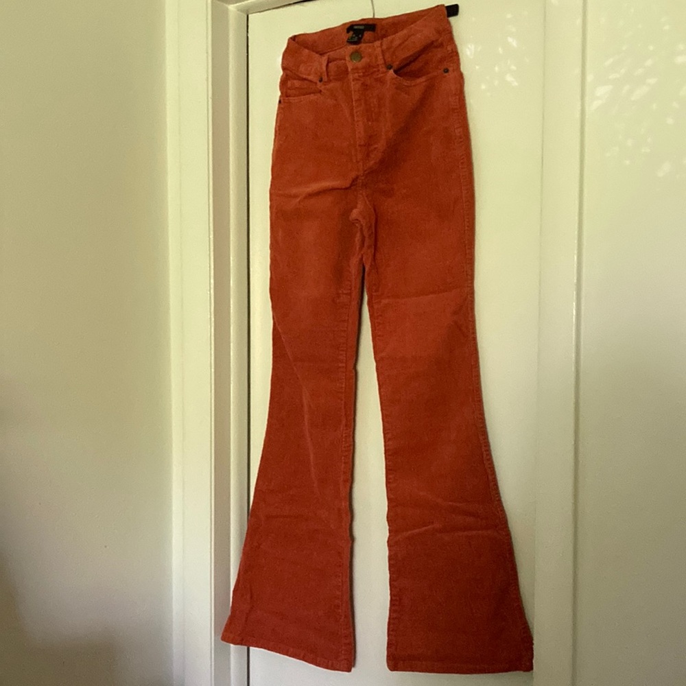 Orange flared corduroy pants